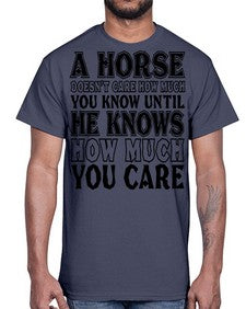 a horse doesnt care how much you know until- horse- Cotton Tee
