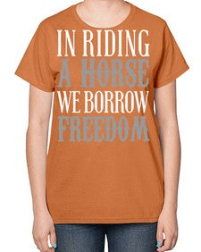 in riding a horse we borrow freedom - horse-  Ladies T-Shirt